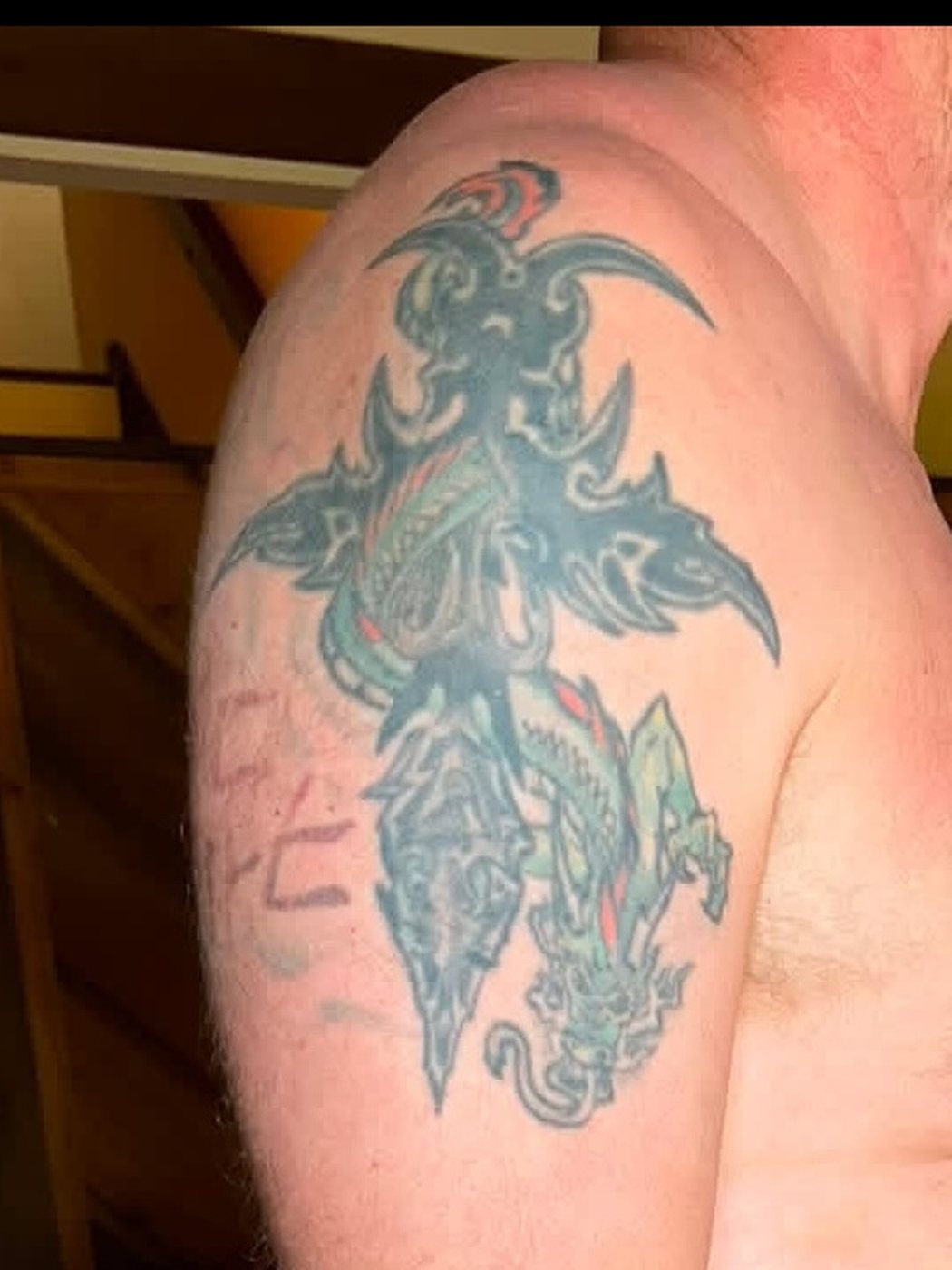 Old colored tribal tattoo before the cover-up