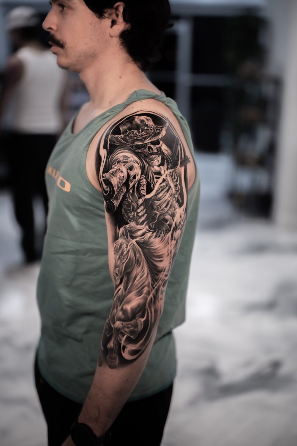 Black and grey western skeleton sleeve tattoo